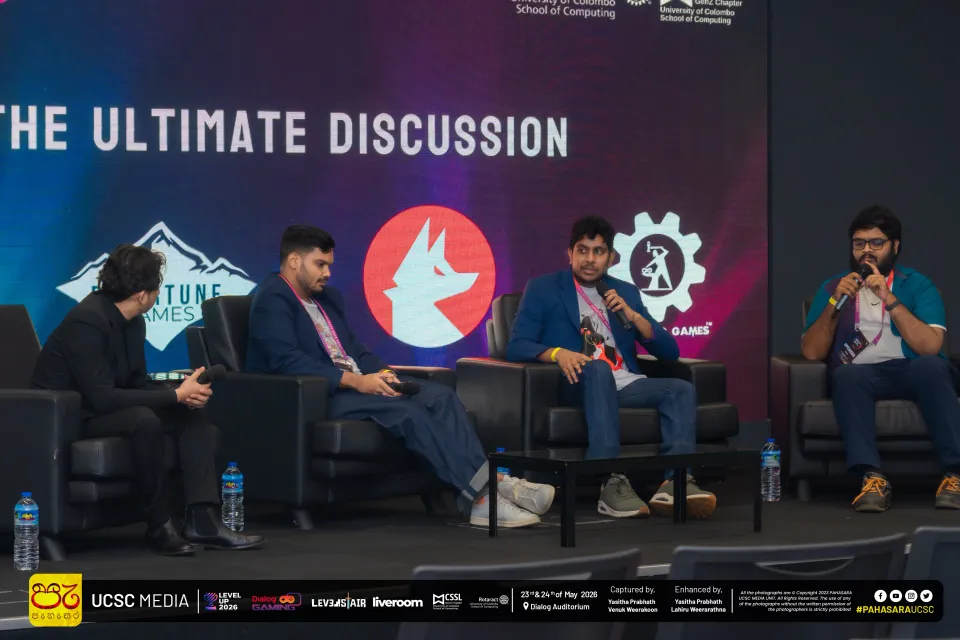 Four people seated on stage during the LKGDC 2026 panel, in front of a screen reading The Ultimate Discussion with the Rivertune Games, Foxtale Studio, and Ironblood Games logos